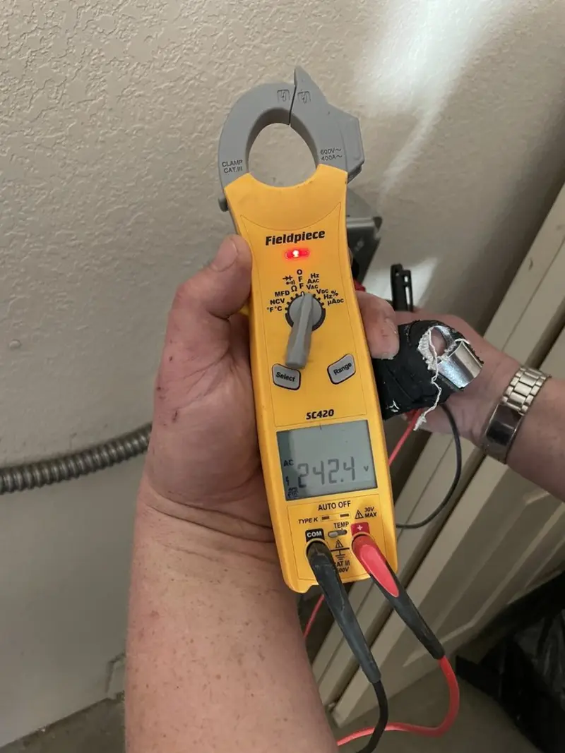 Voltage testing with clamp meter during Outlet Installation in Anderson